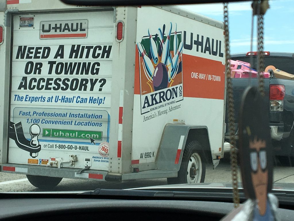 Caption: If you’re near a college campus, you can often get help from local kids who just want $10 or $20 bucks an hour and will help you with hard labor or all of those trips up and down the stairs. And then use a local trailer from a place like UHaul and save some money—you can even learn things from the trailers—like Akron is the Bowling Capital of the World! Bonus points: Instead of asking friends to help you move, invite them to your new place for an awesome tour/gaming session. They may even bring libations!